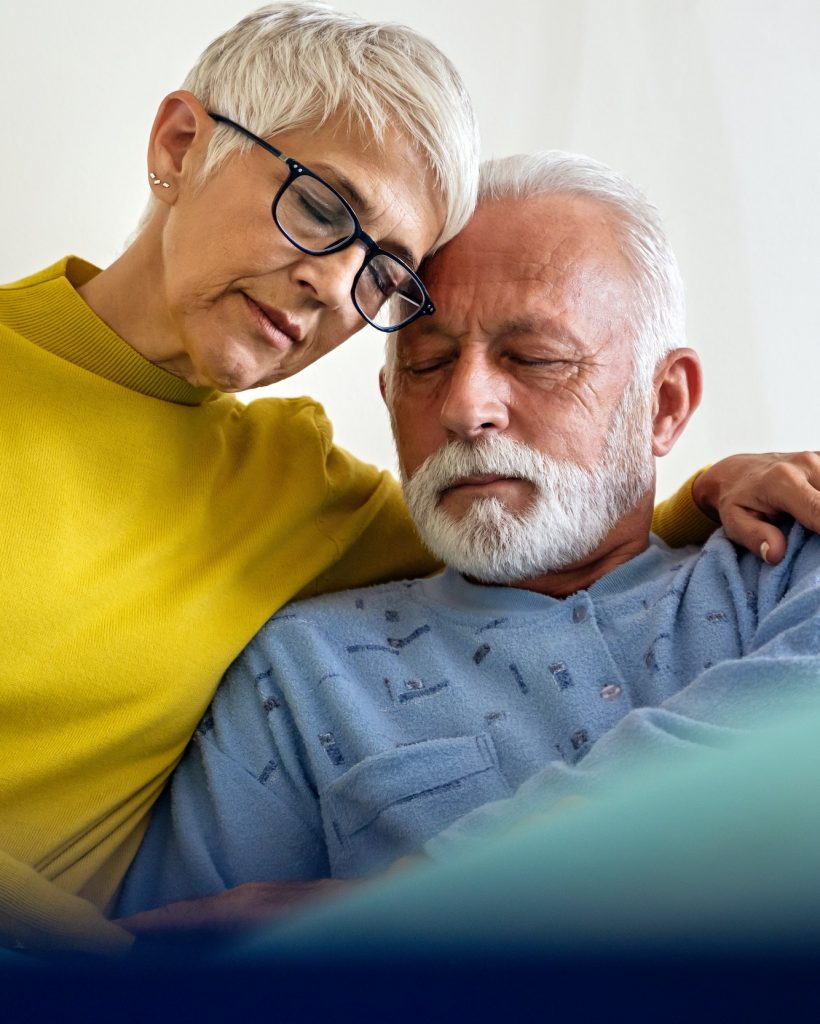 Senior woman with seriously ill husband in hospital. Healthcare support anxiety love concept